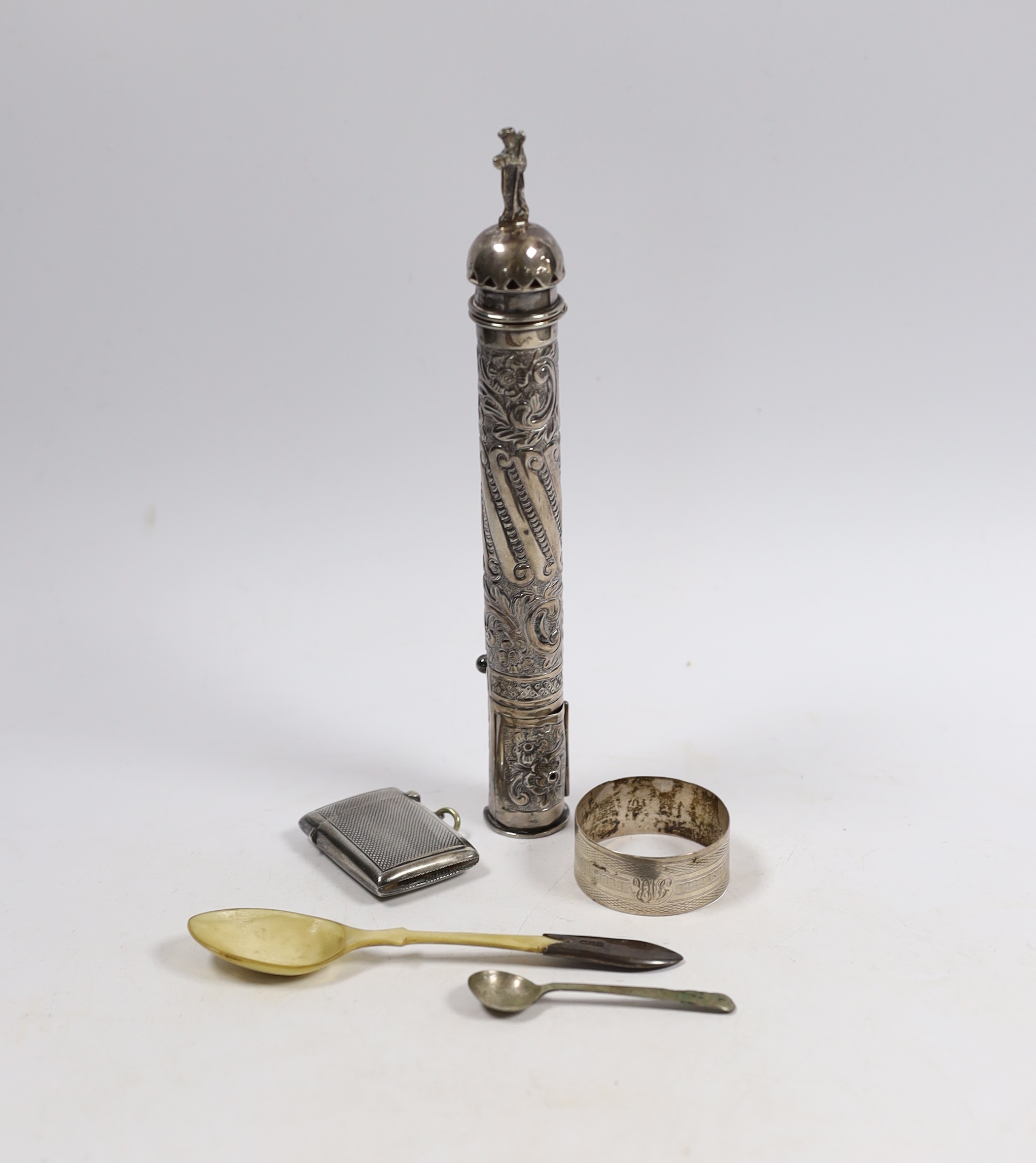 A late Victorian repousse silver sealing wax and match holder, with figural finial, Samuel Jacob, London, 1897, 20.7cm, a silver vesta case, two spoons and a silver napkin ring.